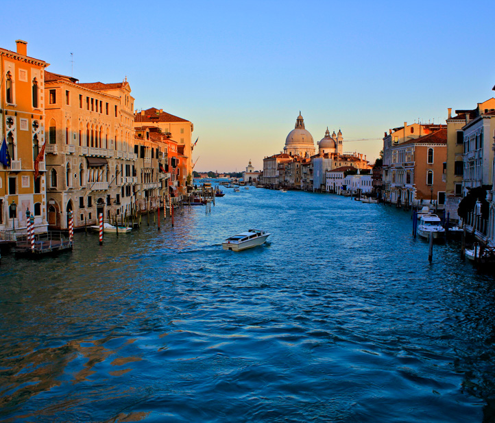 Italian canal at sunset.