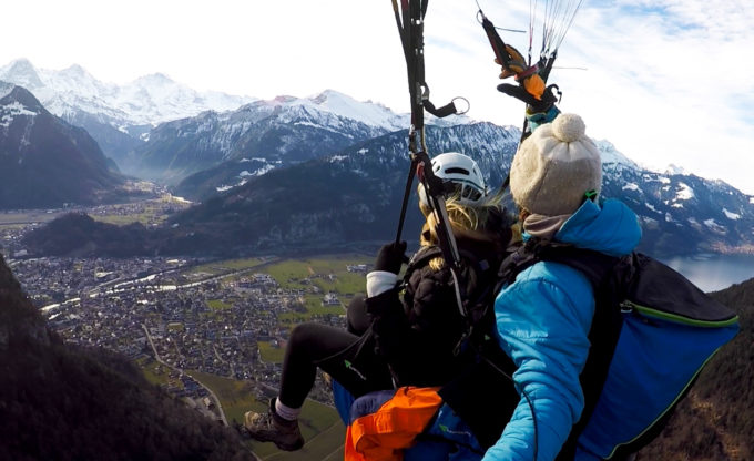 Student and instructor parachuting over Switzerland.