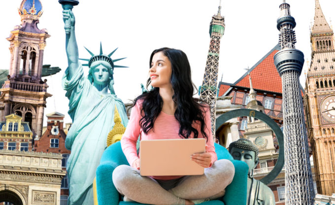 Woman in chair with famous landmarks behind.