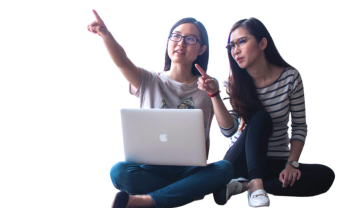 Students with laptop pointing upward.