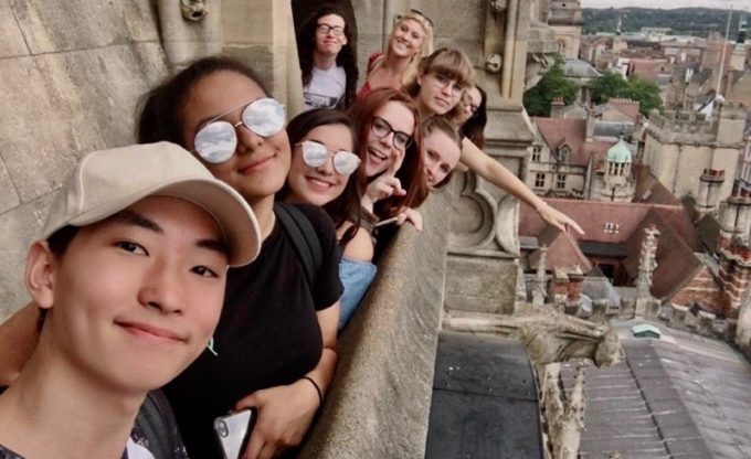 Students on a balcony in Europe.