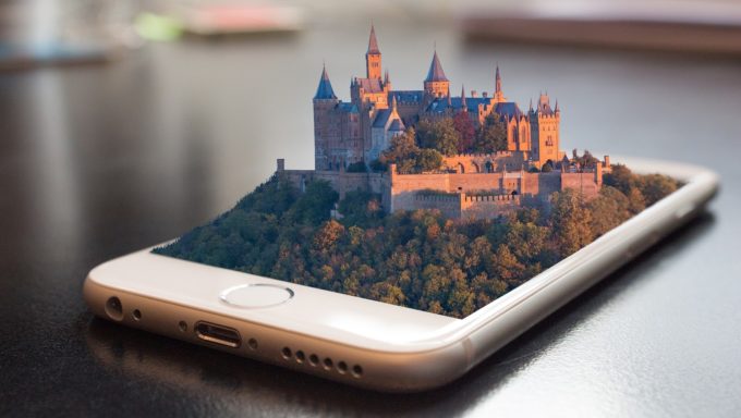 a castle being projected out of a phone