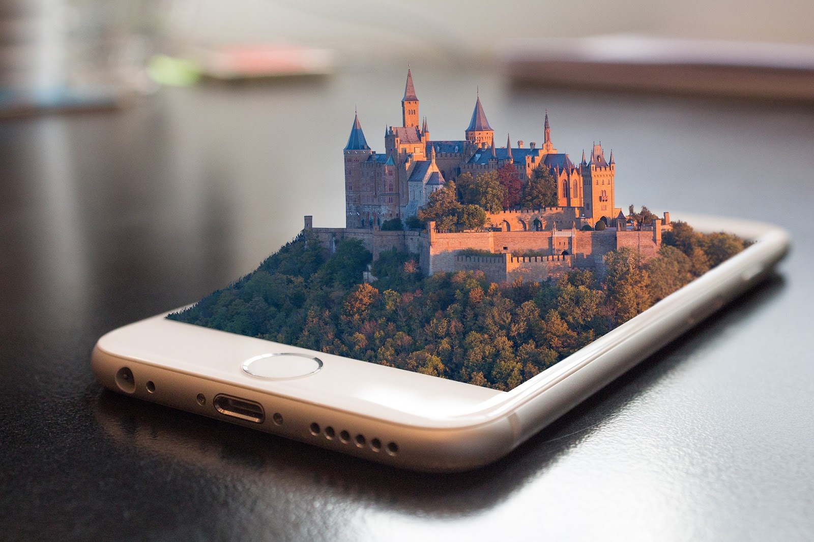 a castle being projected out of a phone